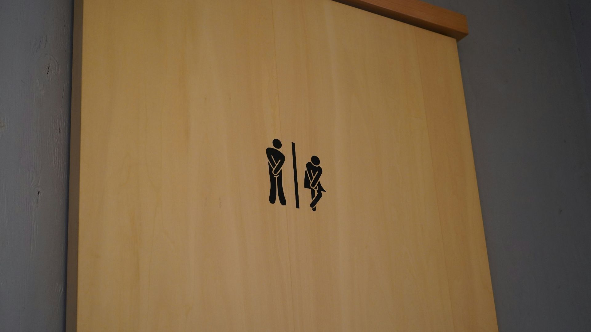 a wood door with black text on it