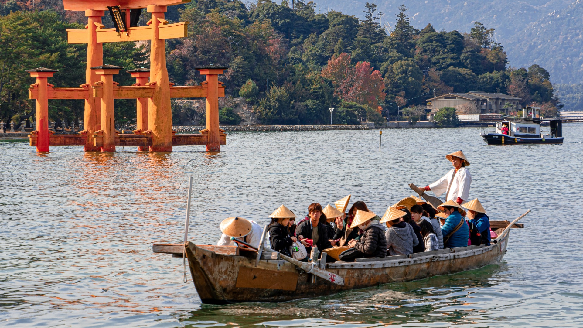 people riding boat on lake during daytime
