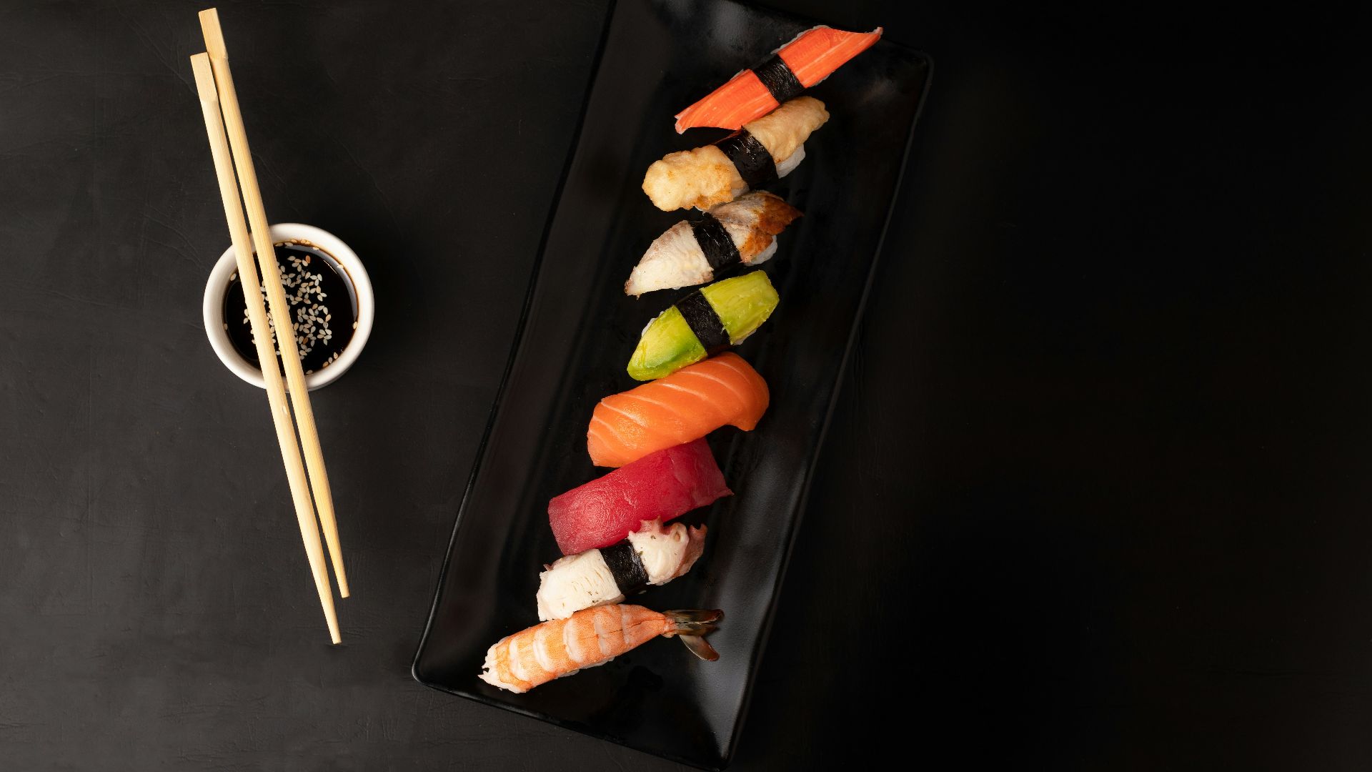 sushi on black square plate