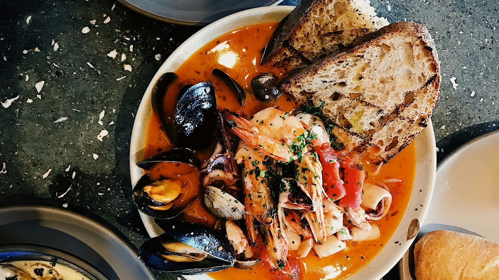 round white ceramic bowl with seafoods