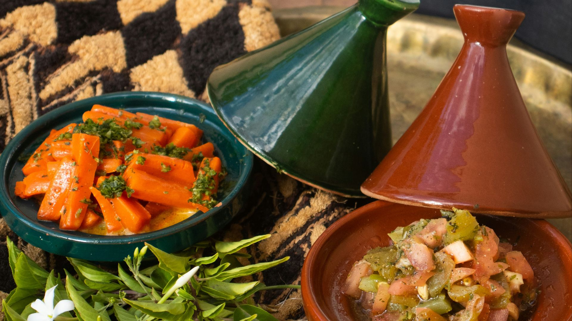 a plate with a bowl of food and a bowl of vegetables
