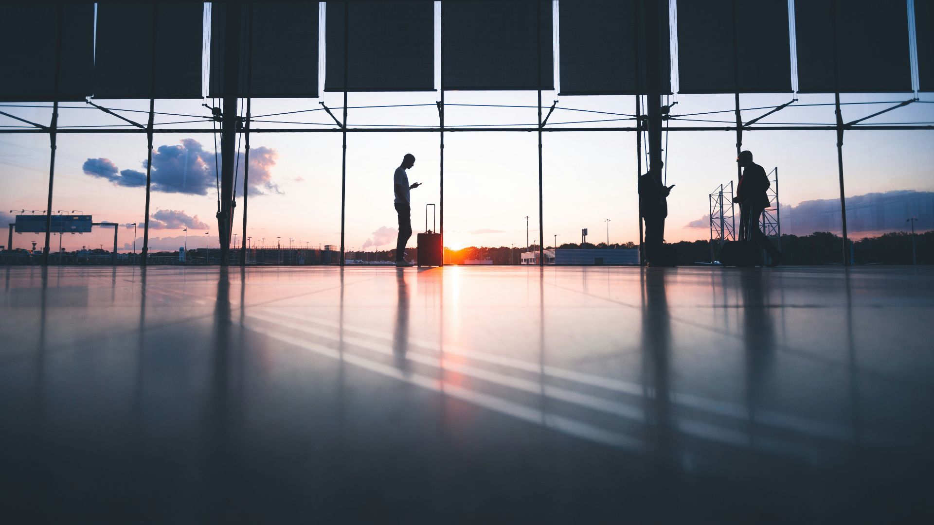 silhouette of person across gray clouds