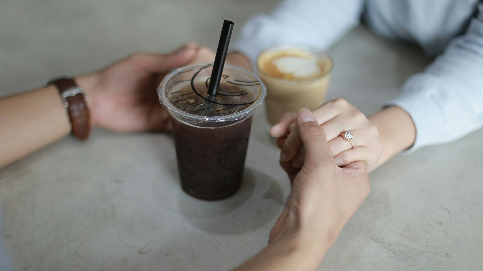 man holding woman's hand