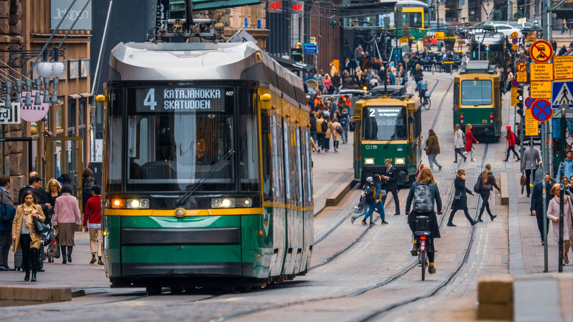 green and yellow city tram