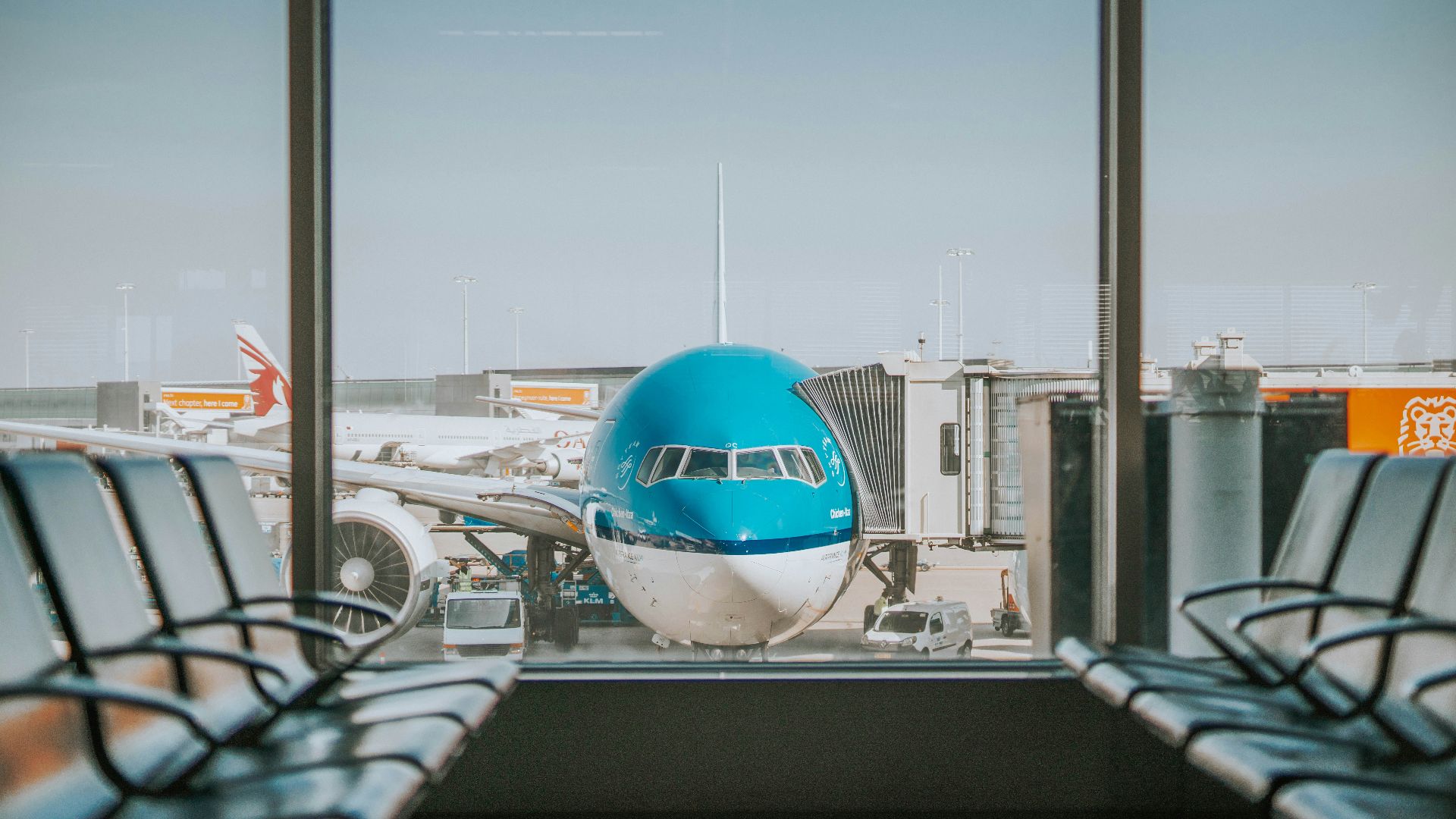 airplane parked near passenger pathway