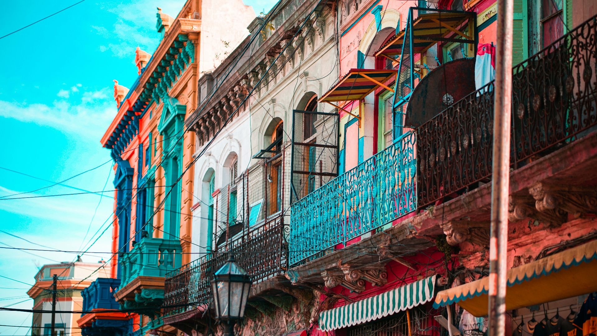 blue and brown concrete building under blue sky during daytime