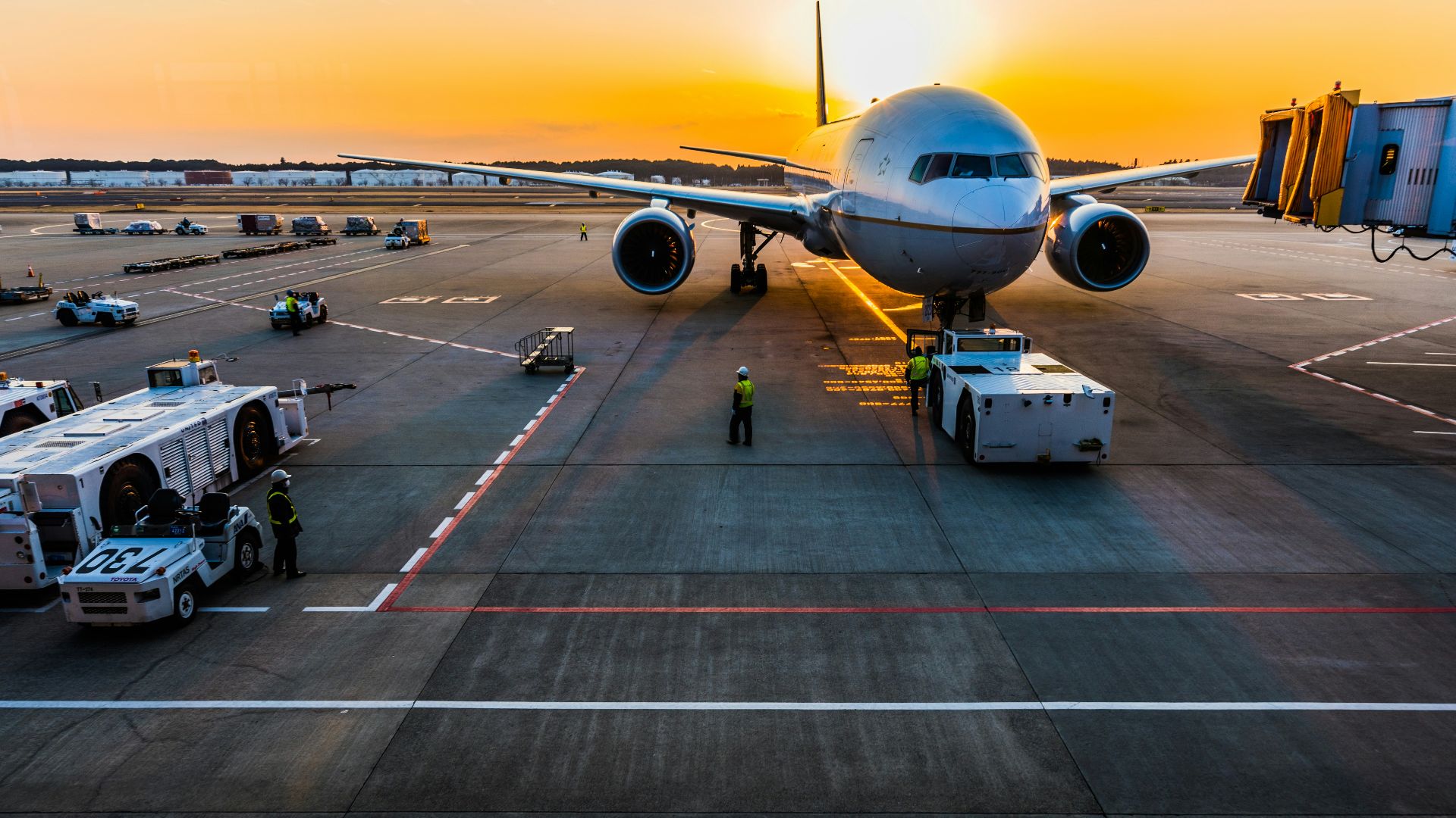 gray airplane on parking