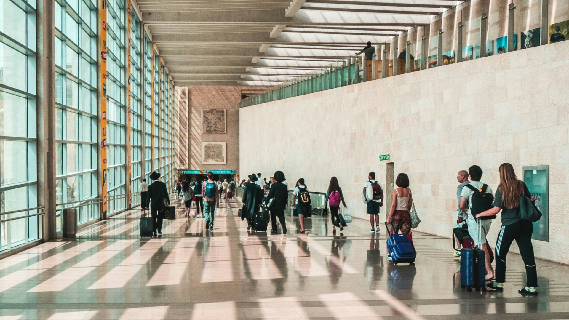 people walking on hallway during daytime