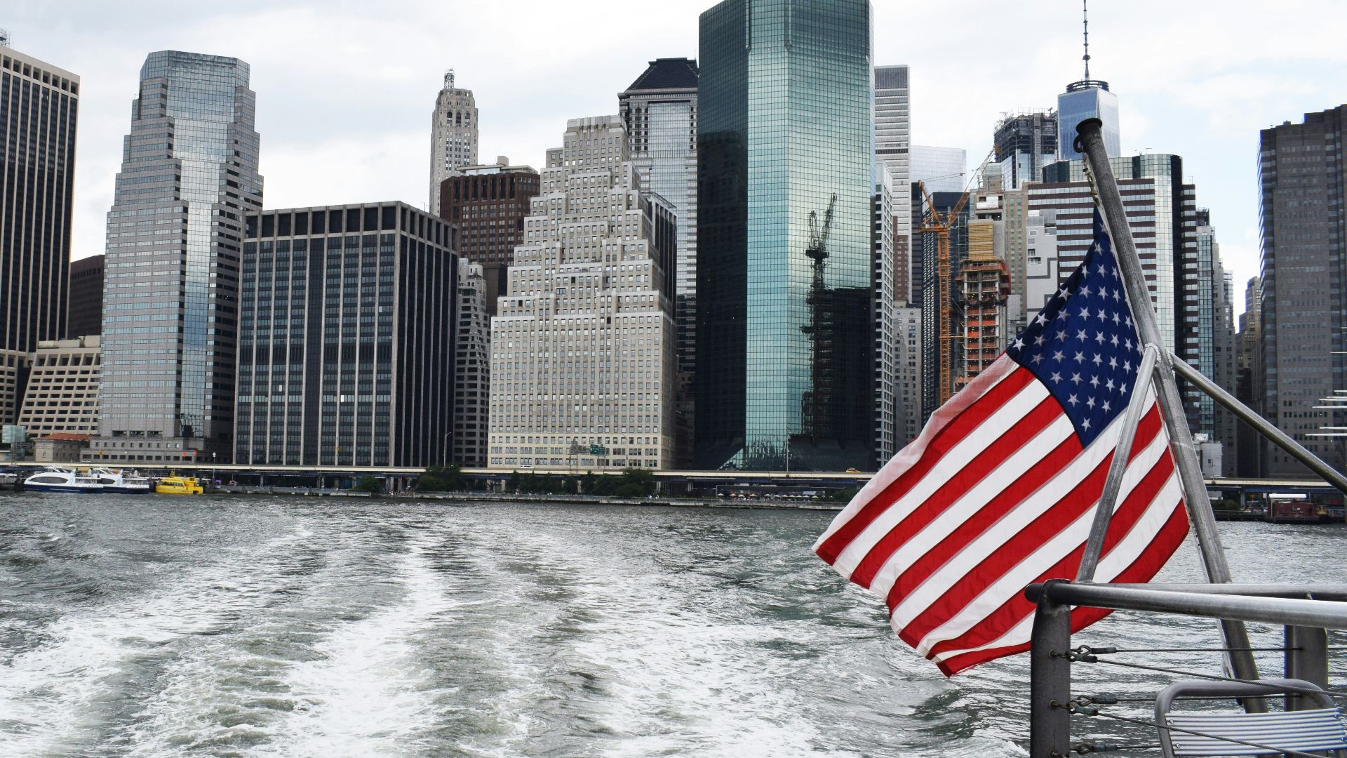 U.S.A. flag on boat near city