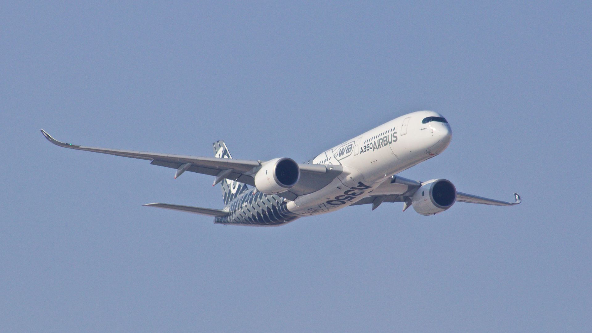white airplane taking off during daytime