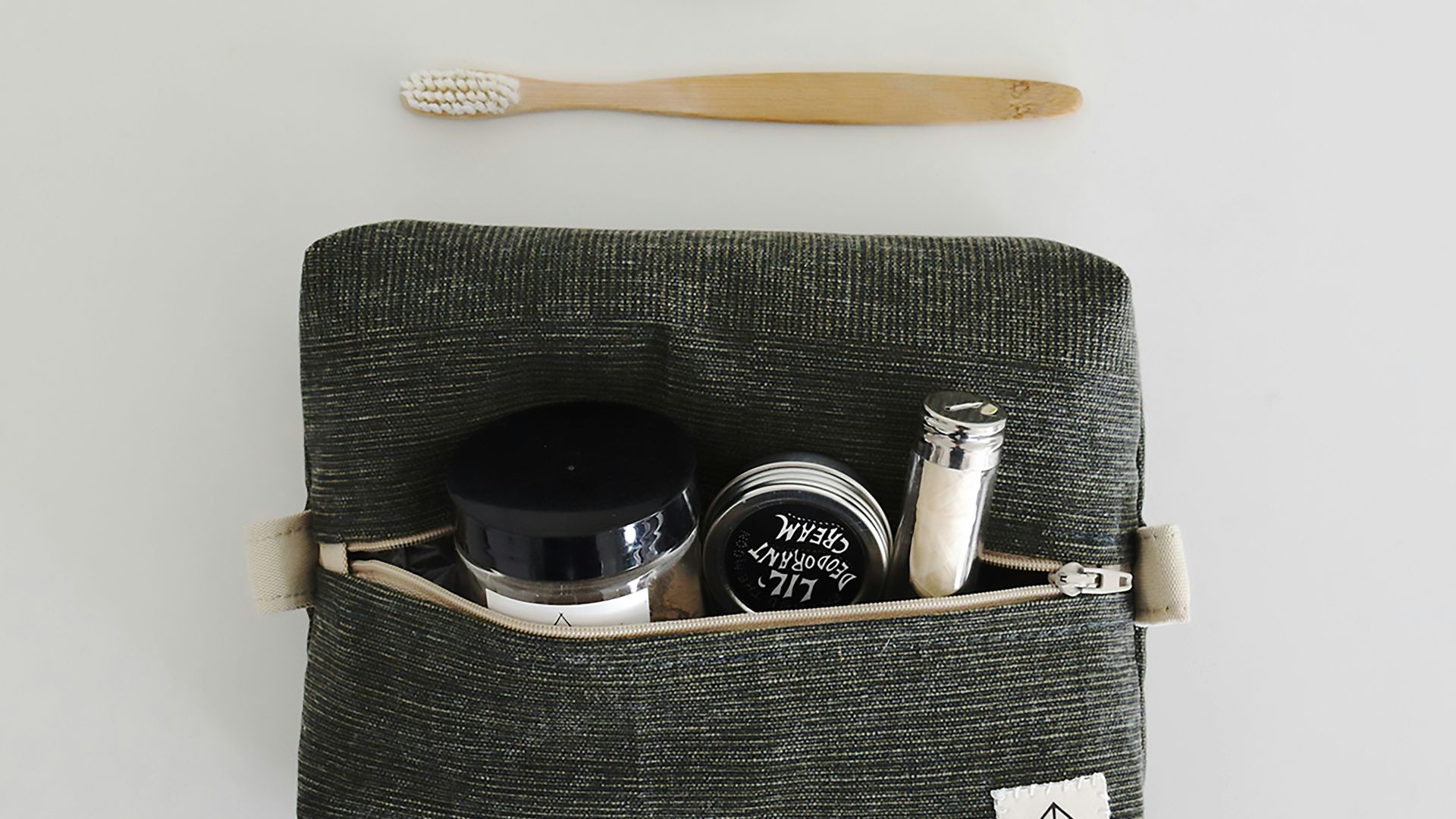 Toiletries and personal care items laid out flat.