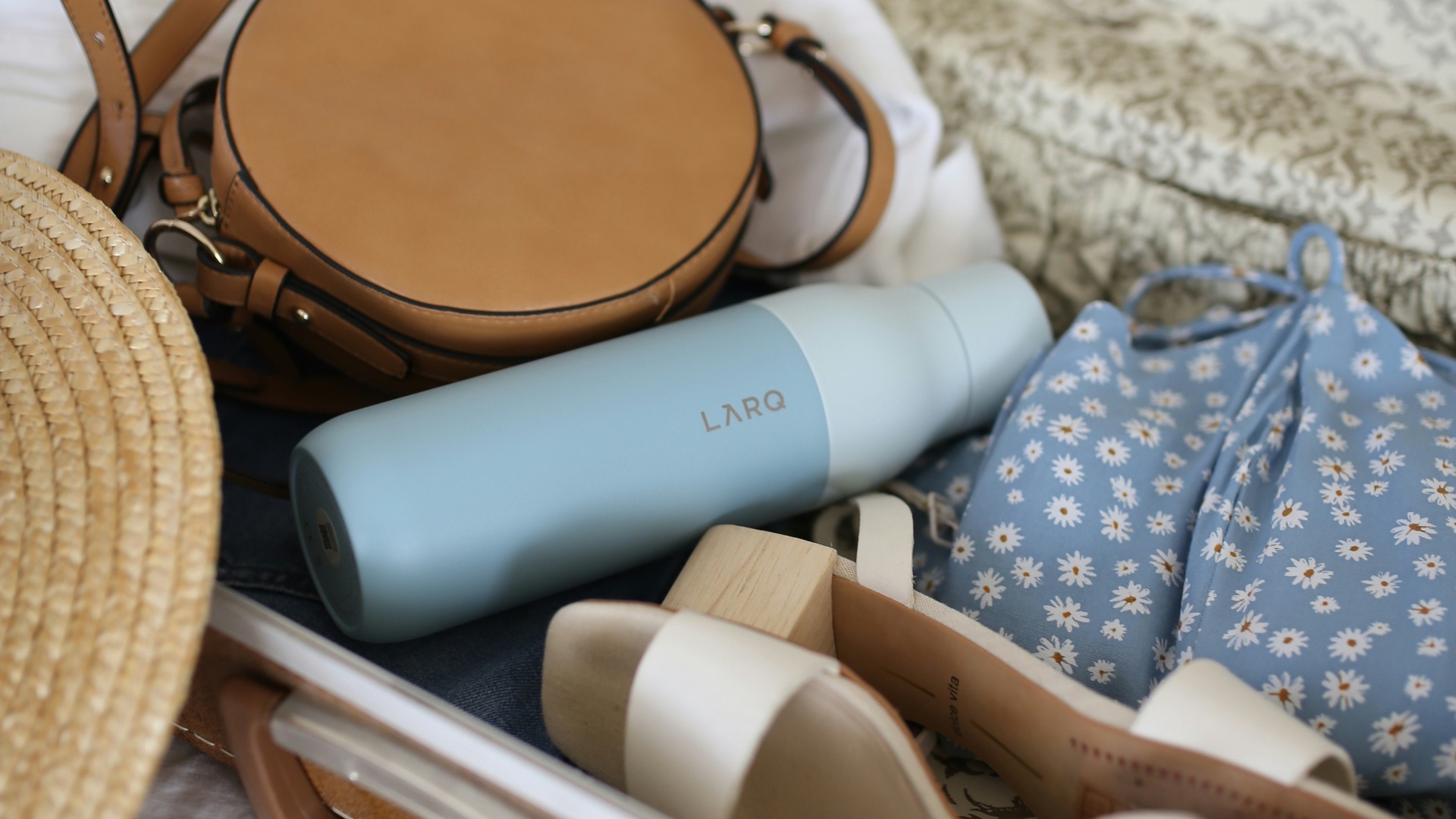 brown and gray leather suitcase