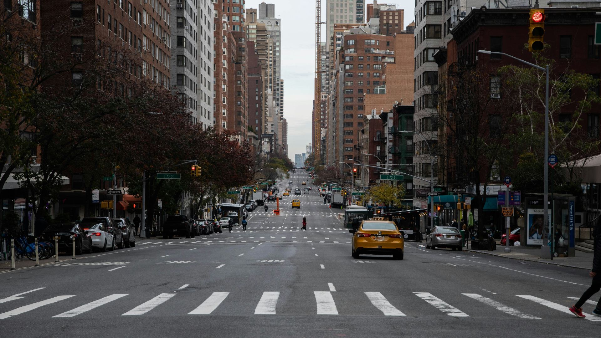 a city street filled with lots of tall buildings
