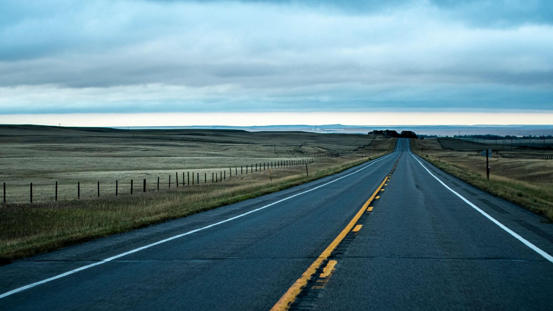 a long empty road in the middle of nowhere