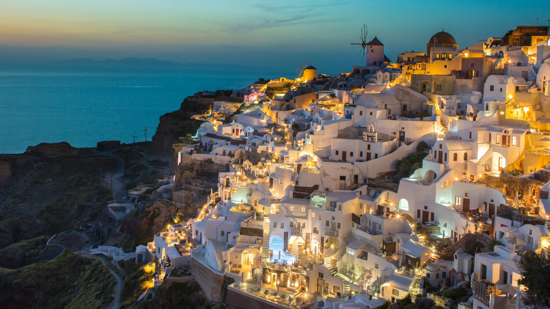 white and brown concrete houses on mountain near sea during daytime