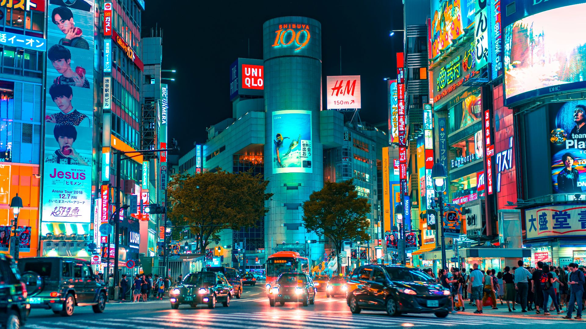 people gathered outside buildings and vehicles