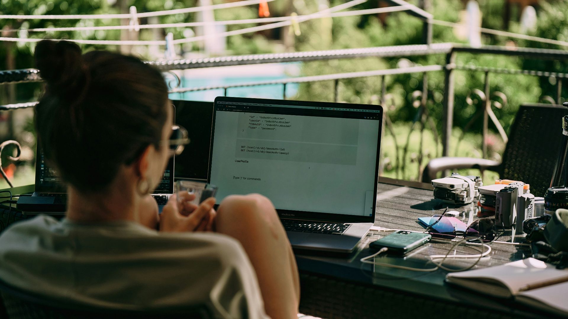 a person sitting at a desk with a laptop