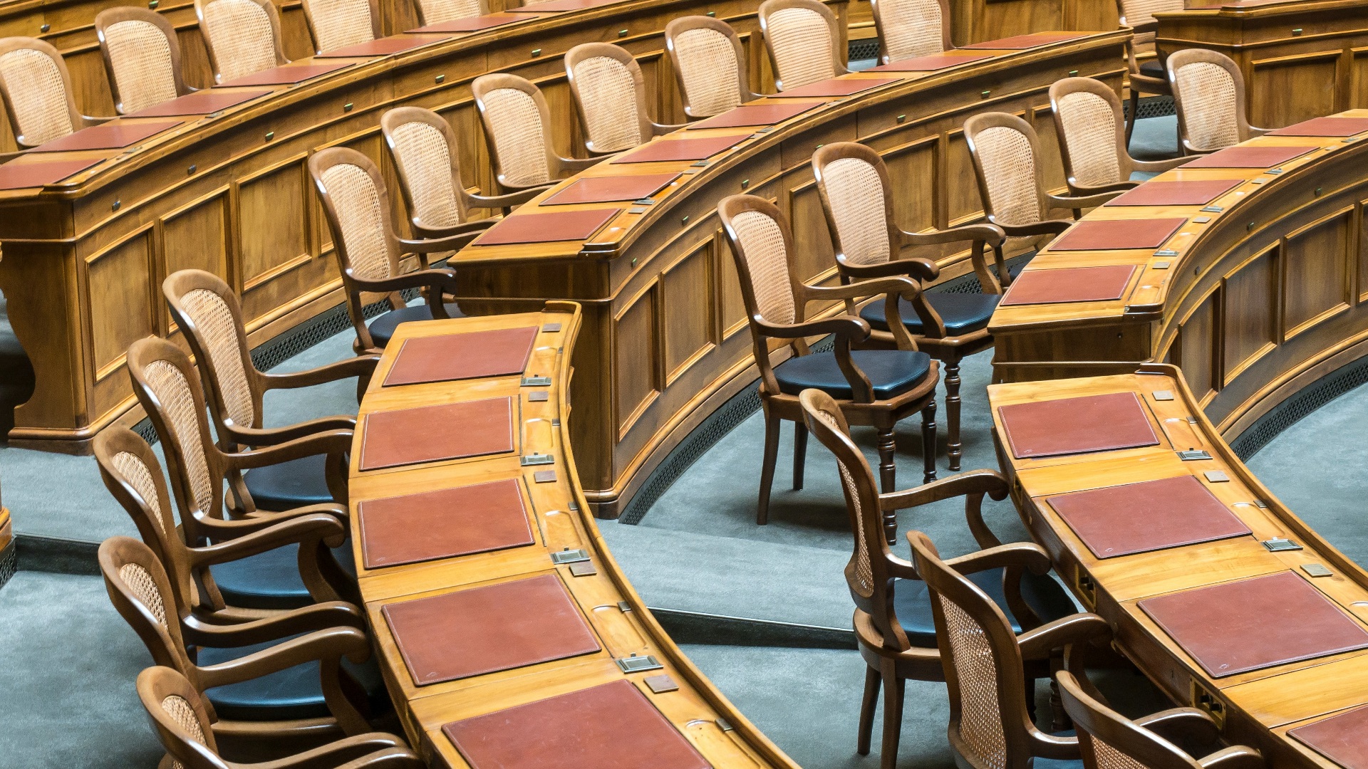 brown wooden chairs on blue and brown wooden floor