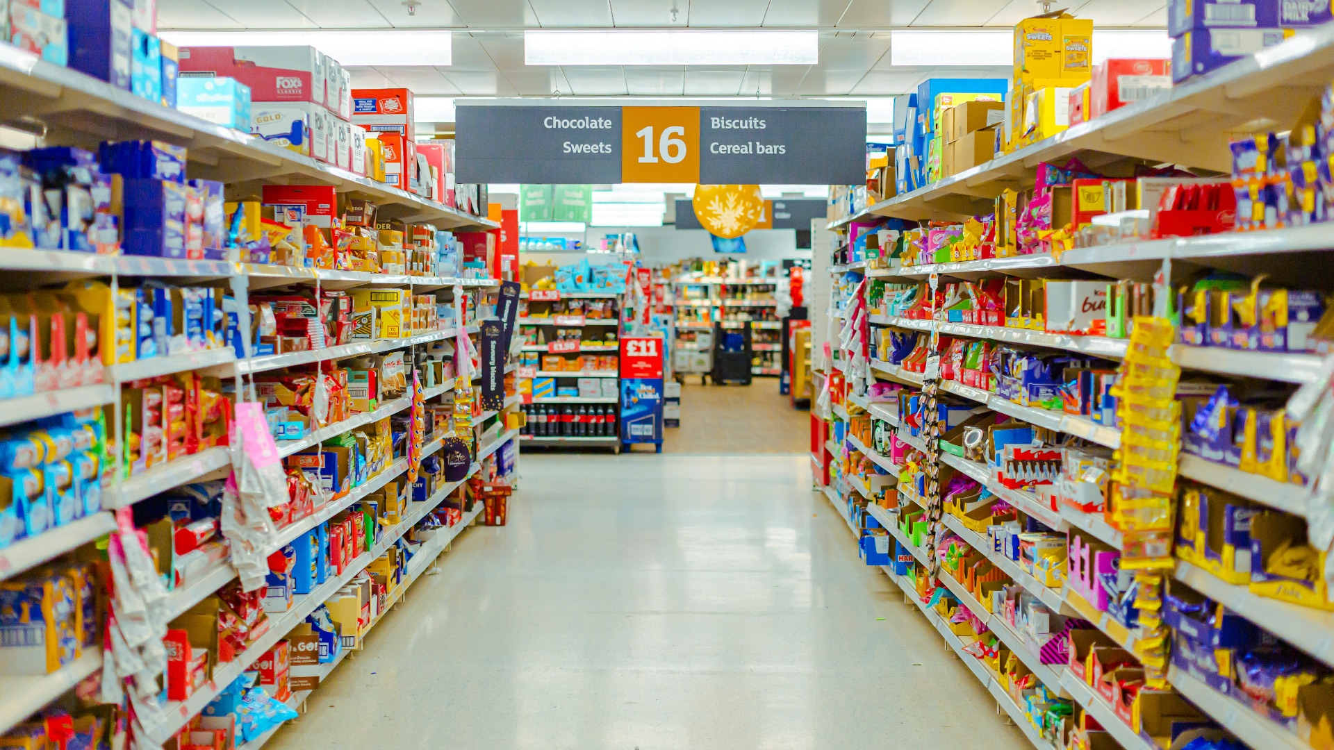 a grocery store aisle filled with lots of food
