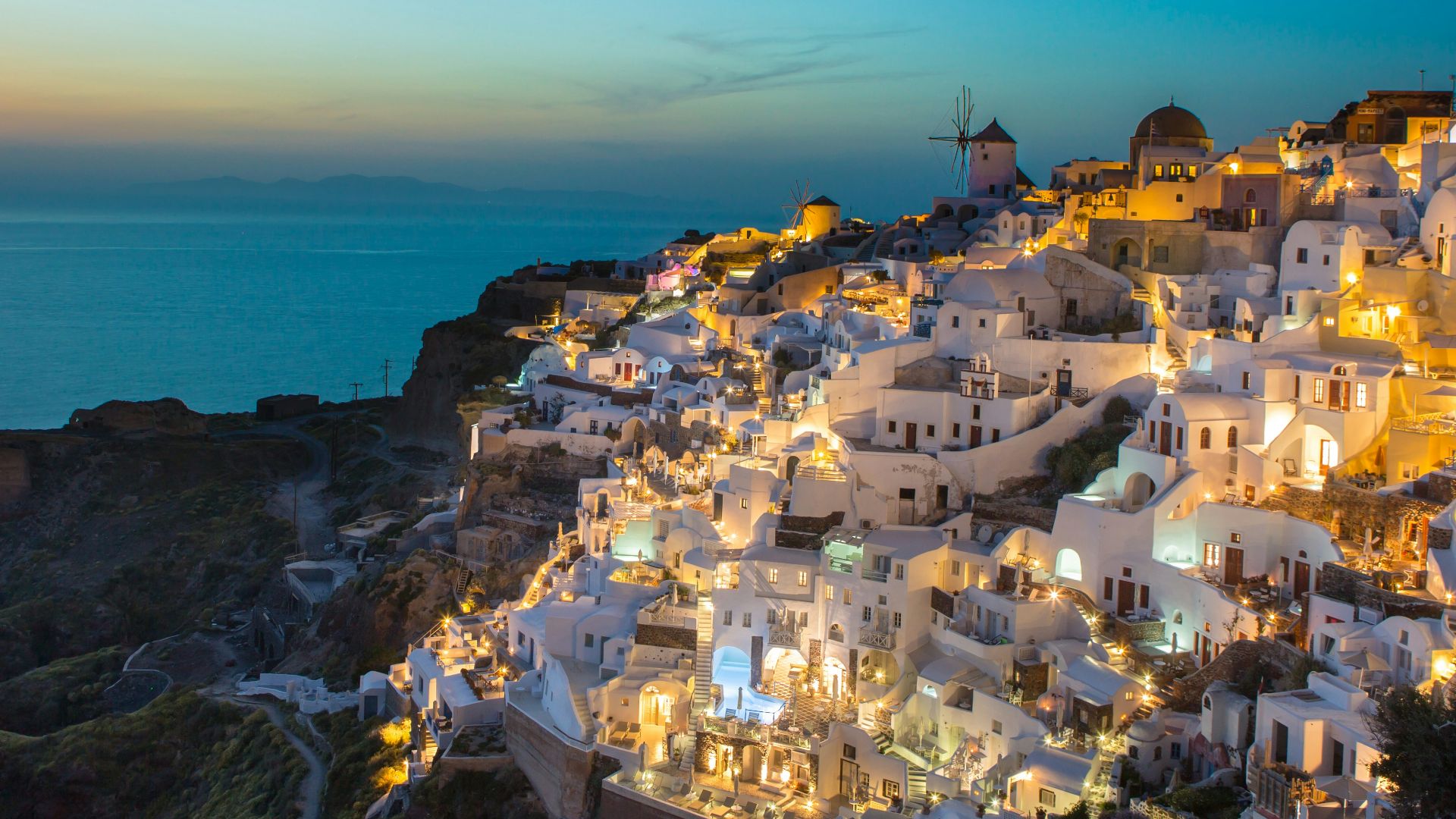 white and brown concrete houses on mountain near sea during daytime