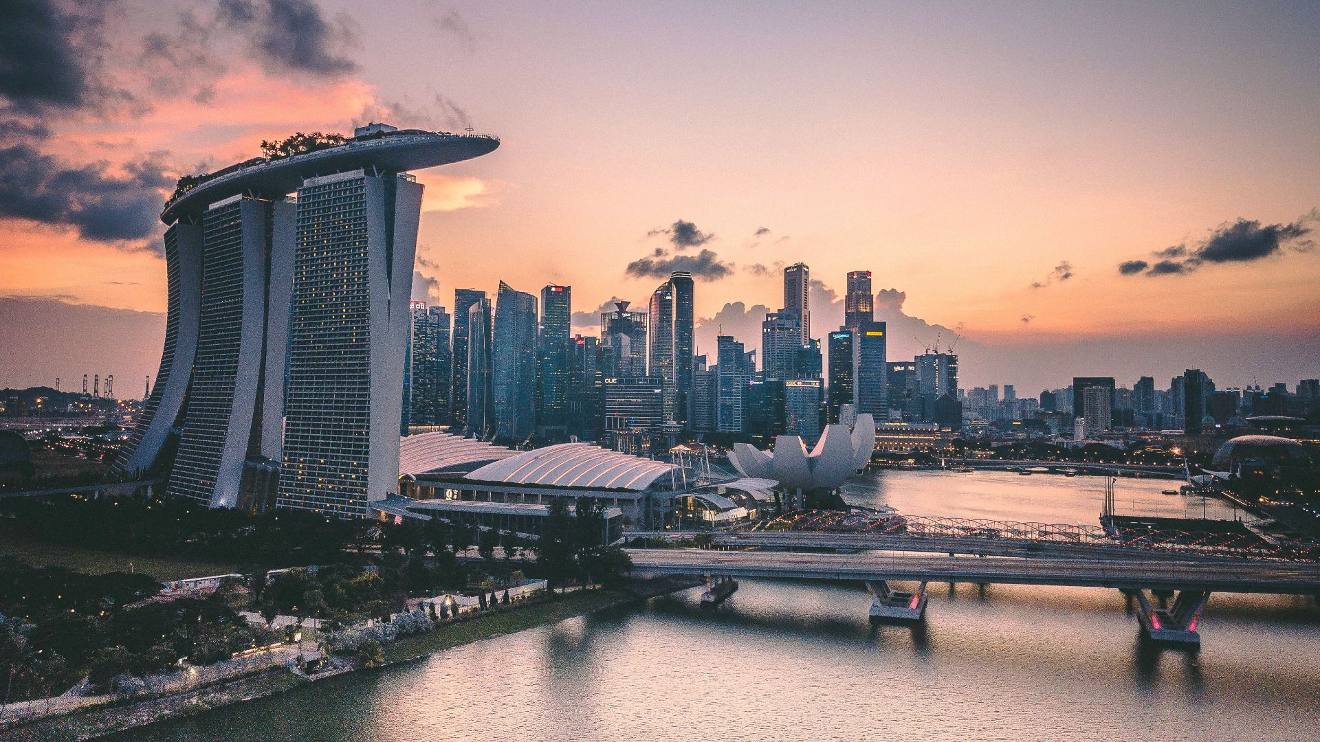 a large body of water with a city in the background