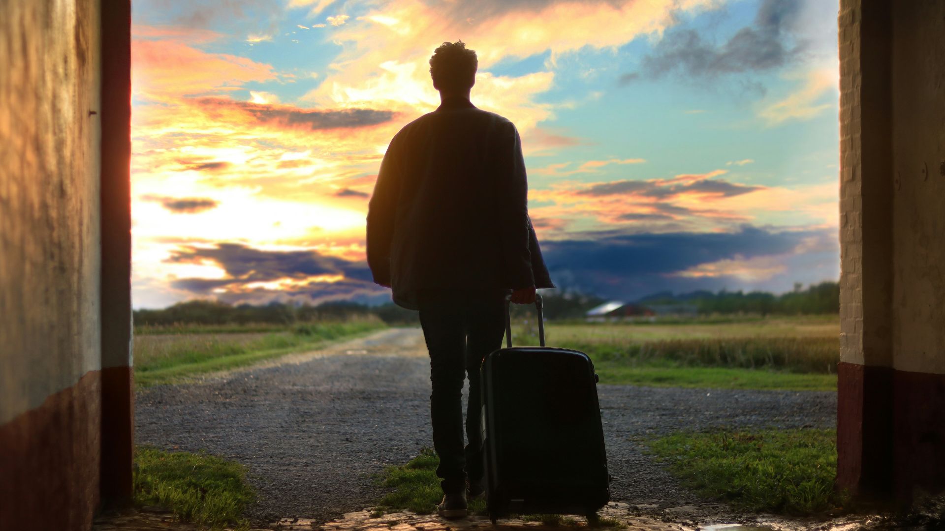 man holding luggage photo