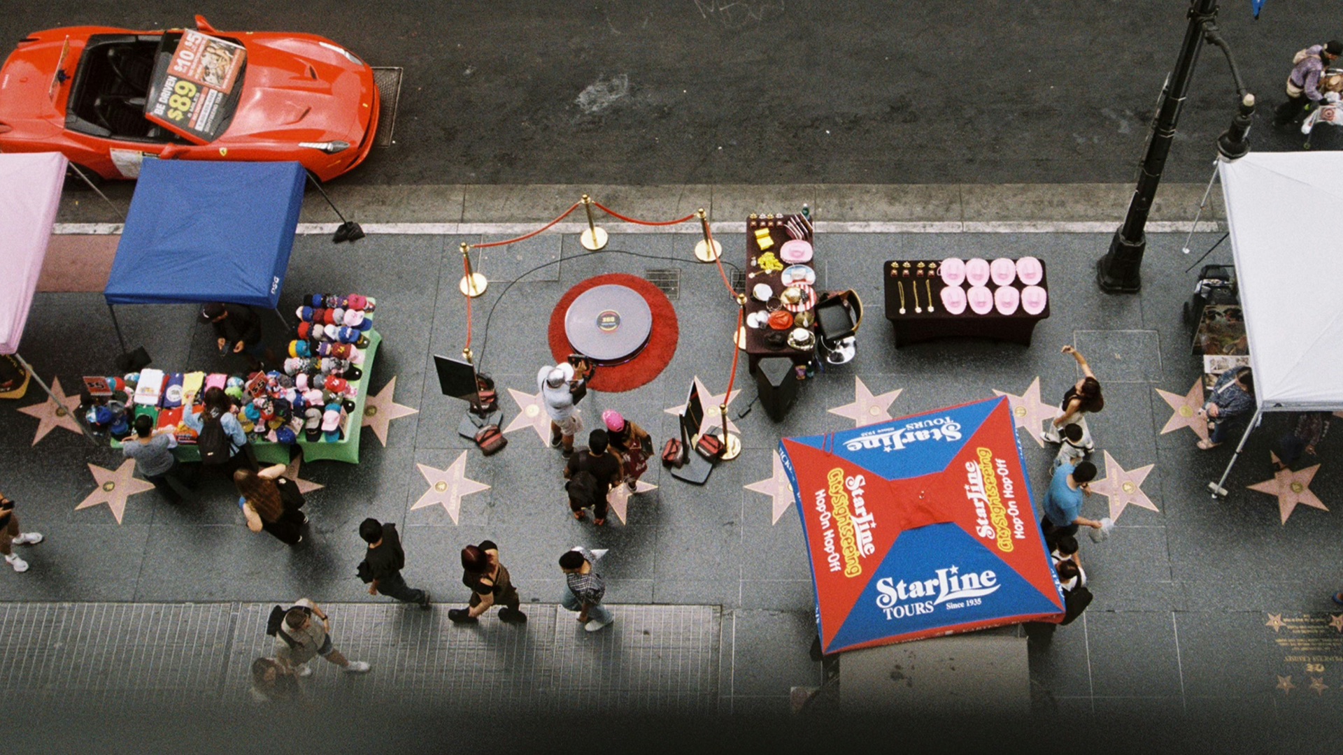 People walk on hollywood's walk of fame.