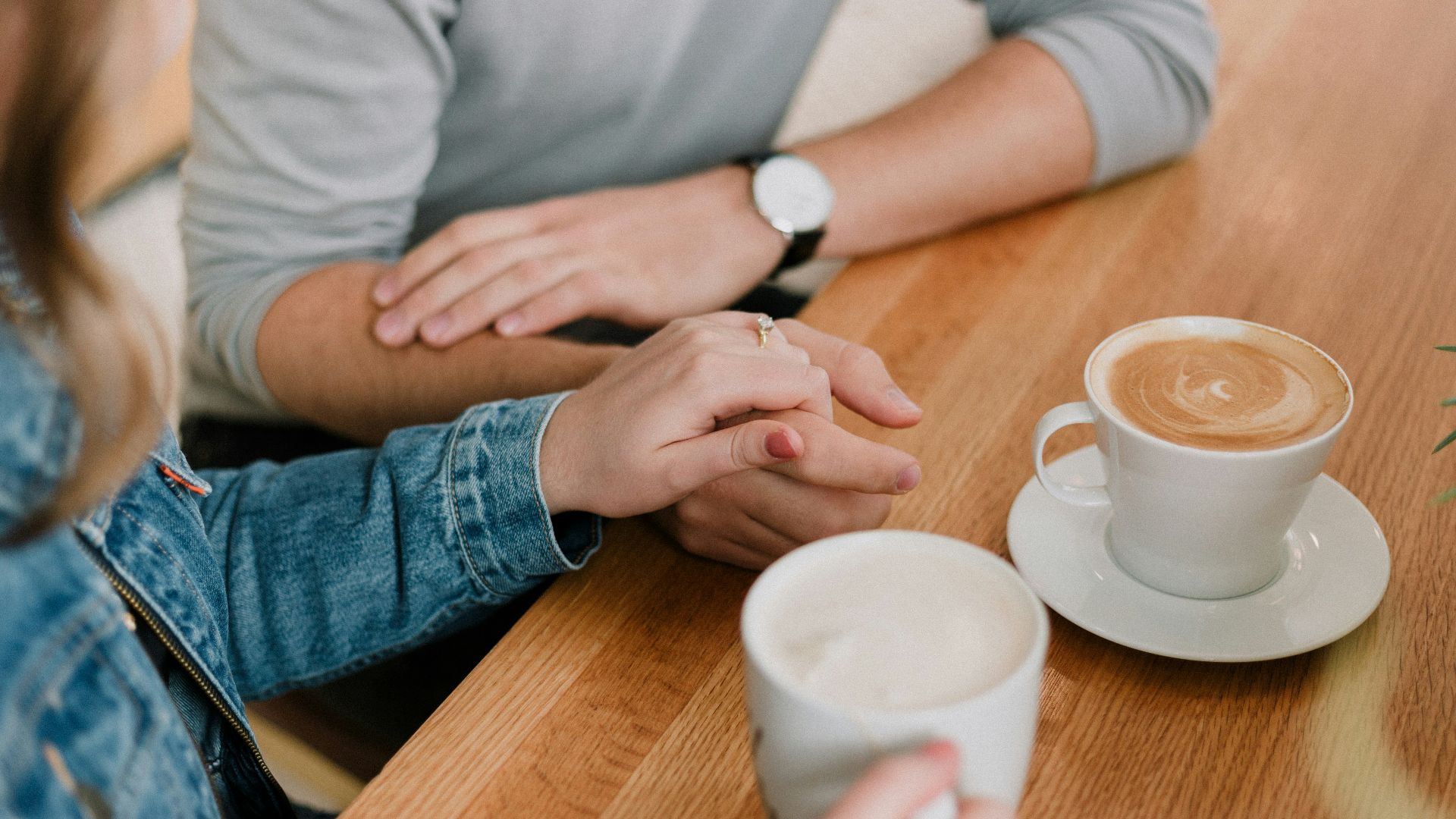 man and woman holding hands