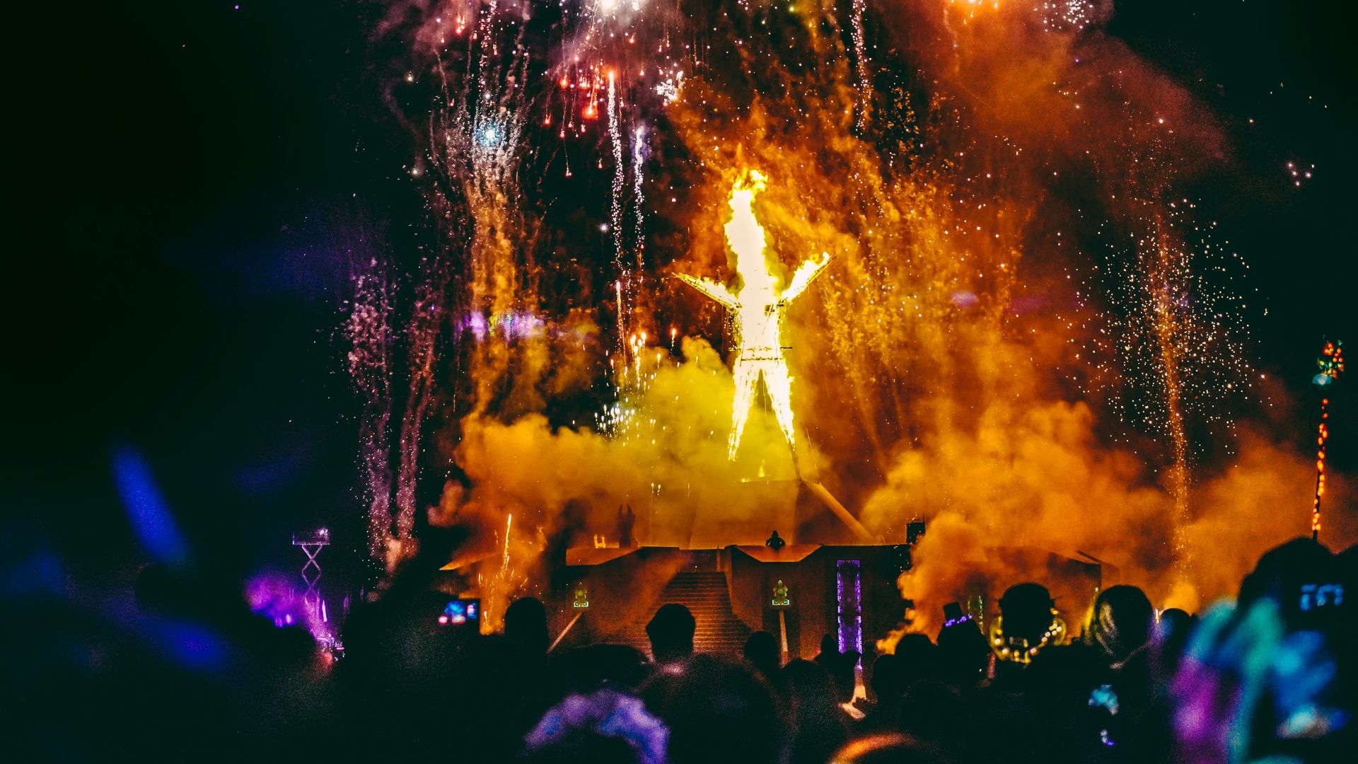 crowd of people watching fireworks display