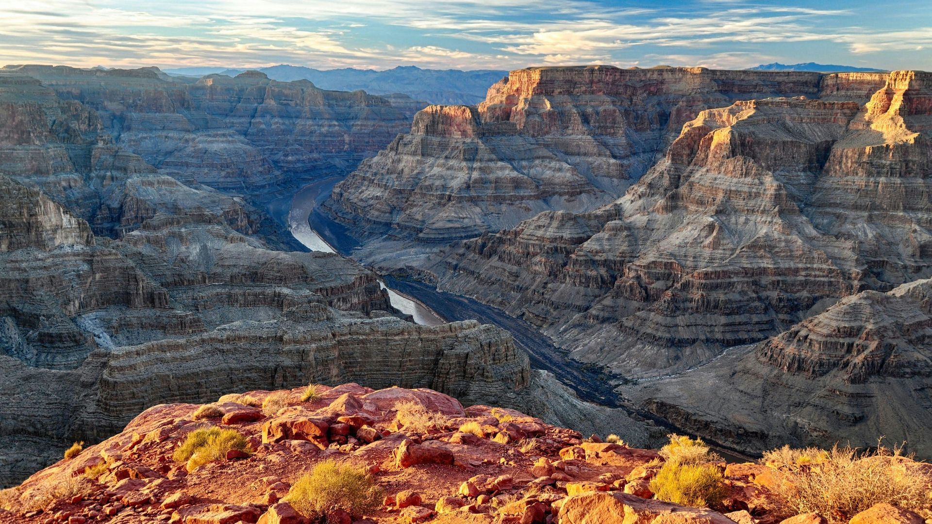 brown rocky mountain under white clouds during daytime