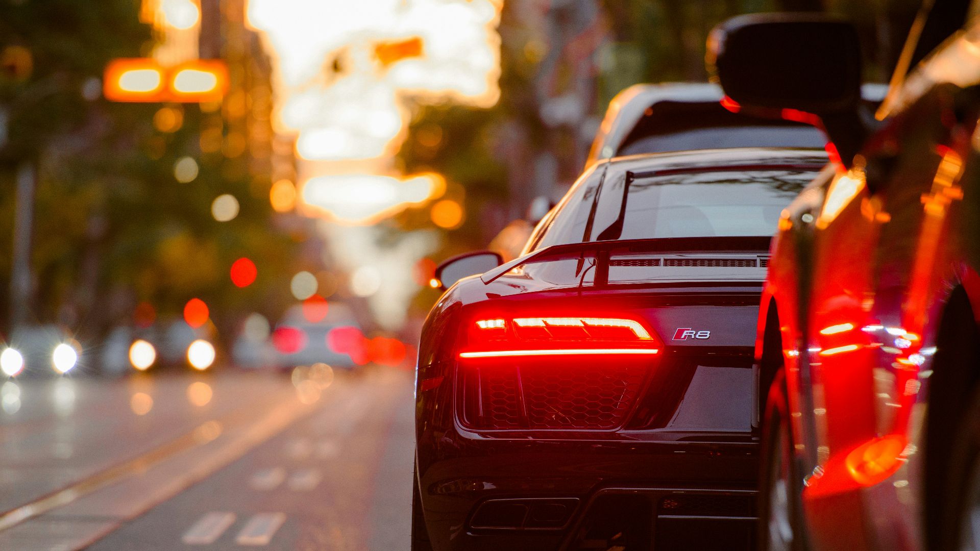 black Audi R8 parked beside road