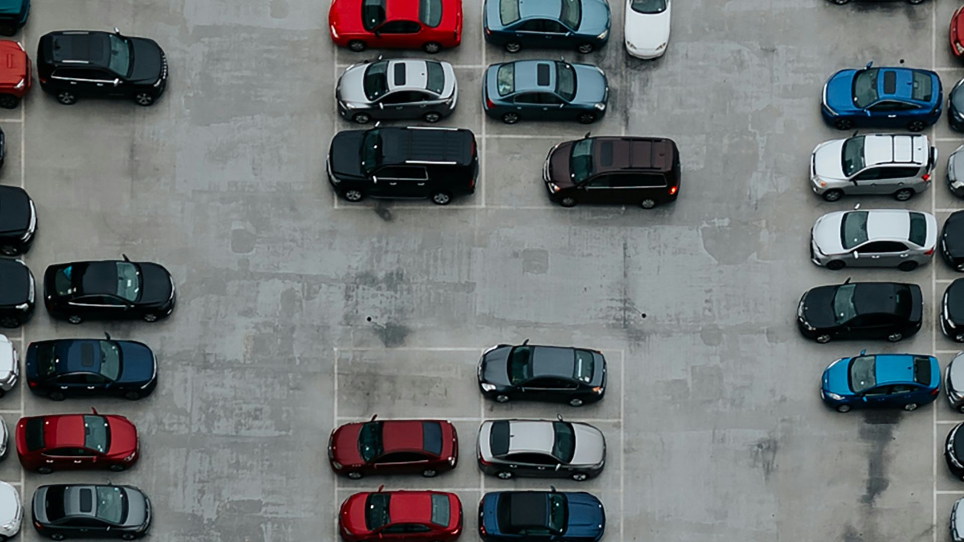 aerial photography of cars on parking lot