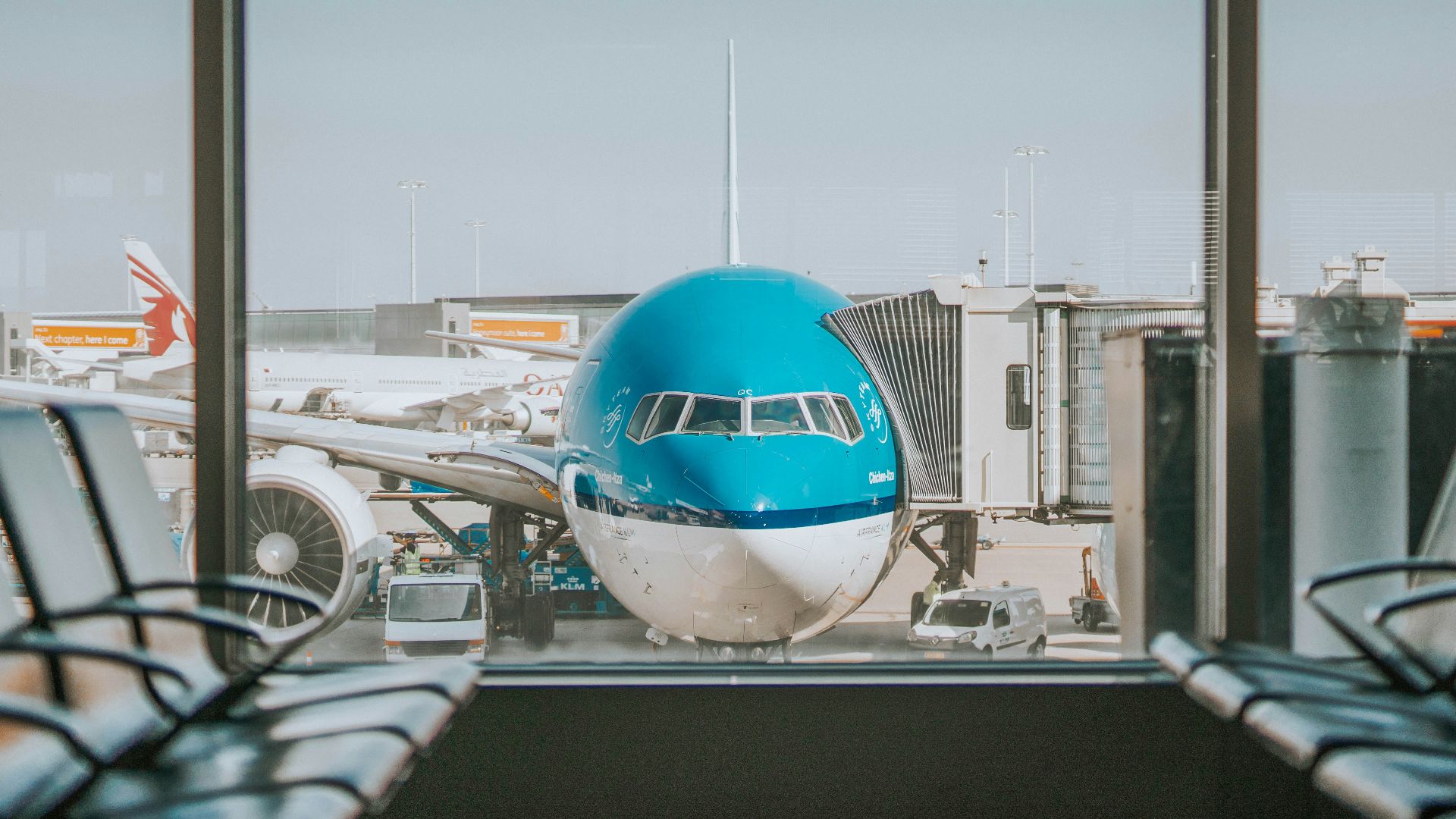 airplane parked near passenger pathway