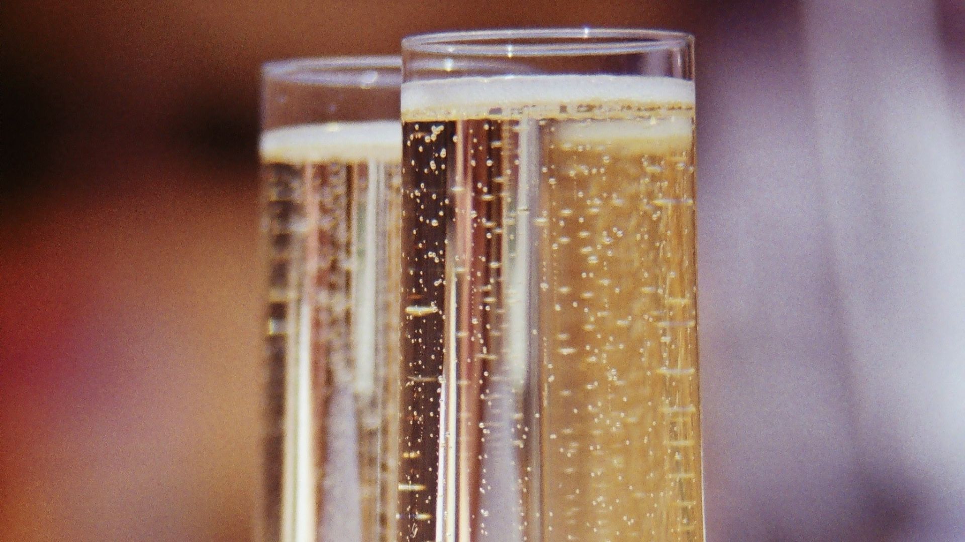 clear wine glass with brown liquid