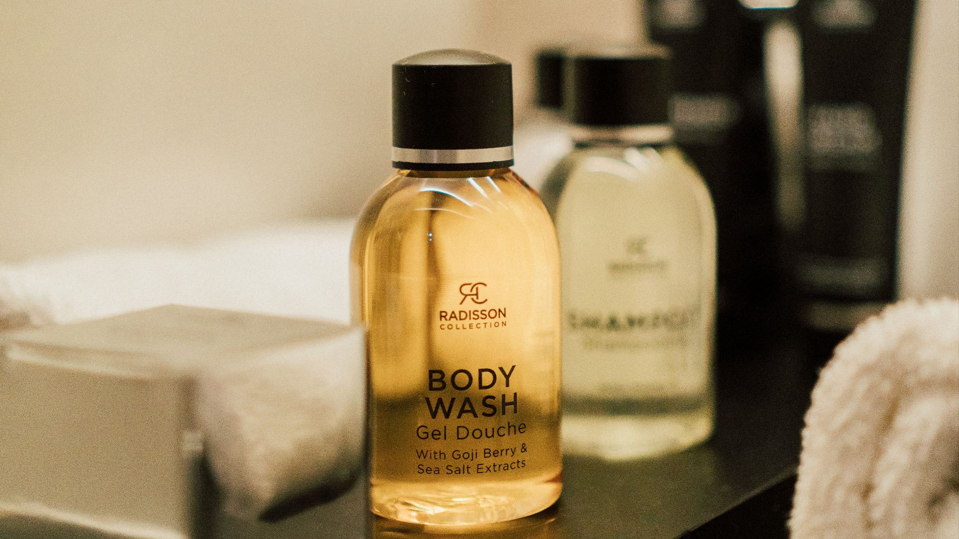 a close up of a bottle of soap on a table