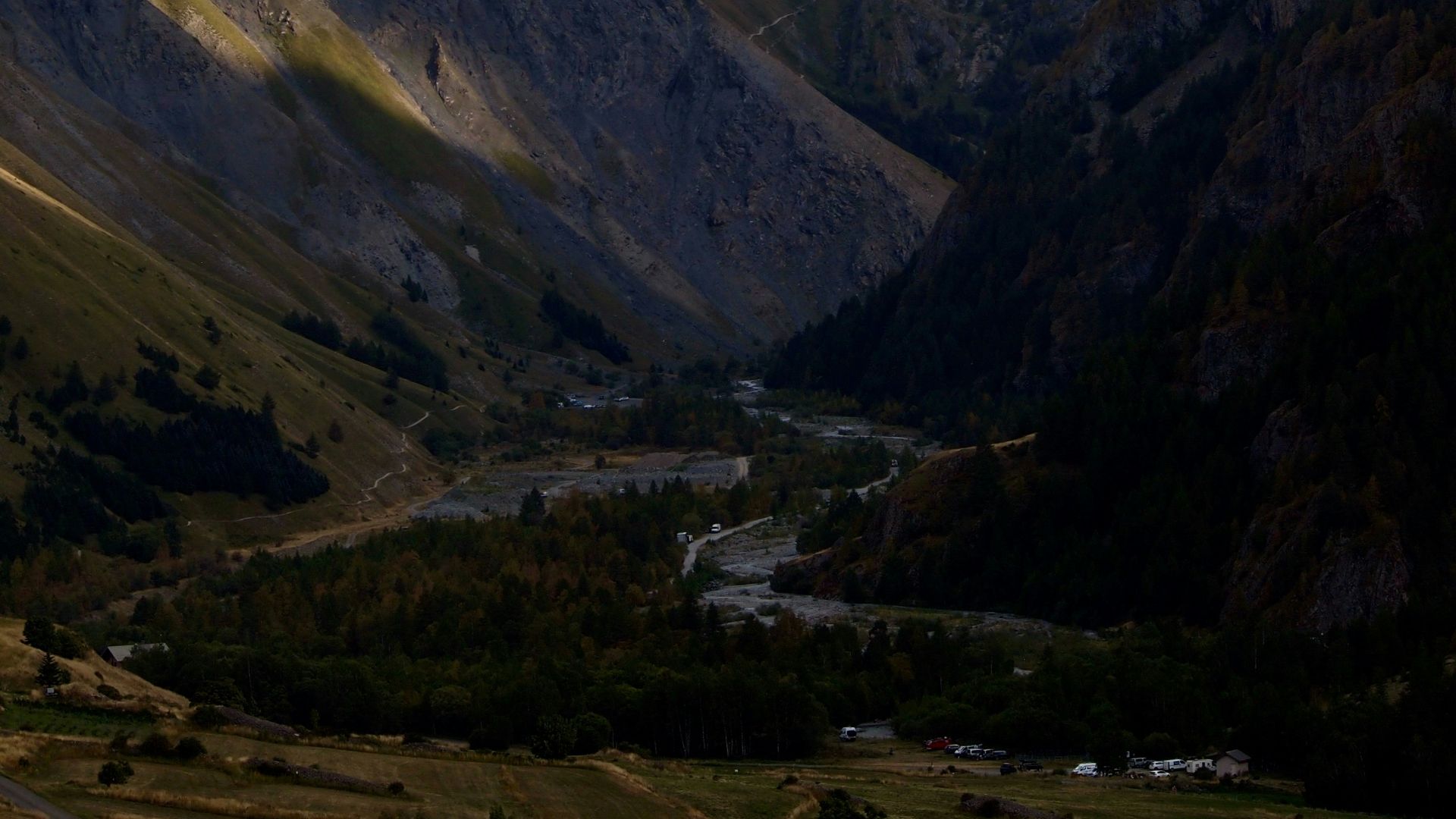 a view of a valley with mountains in the background
