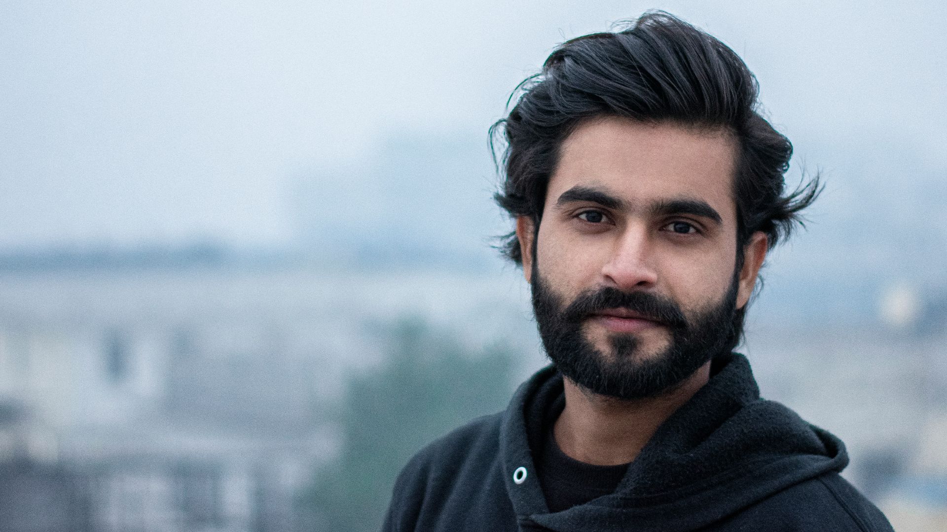 man in black zip up jacket