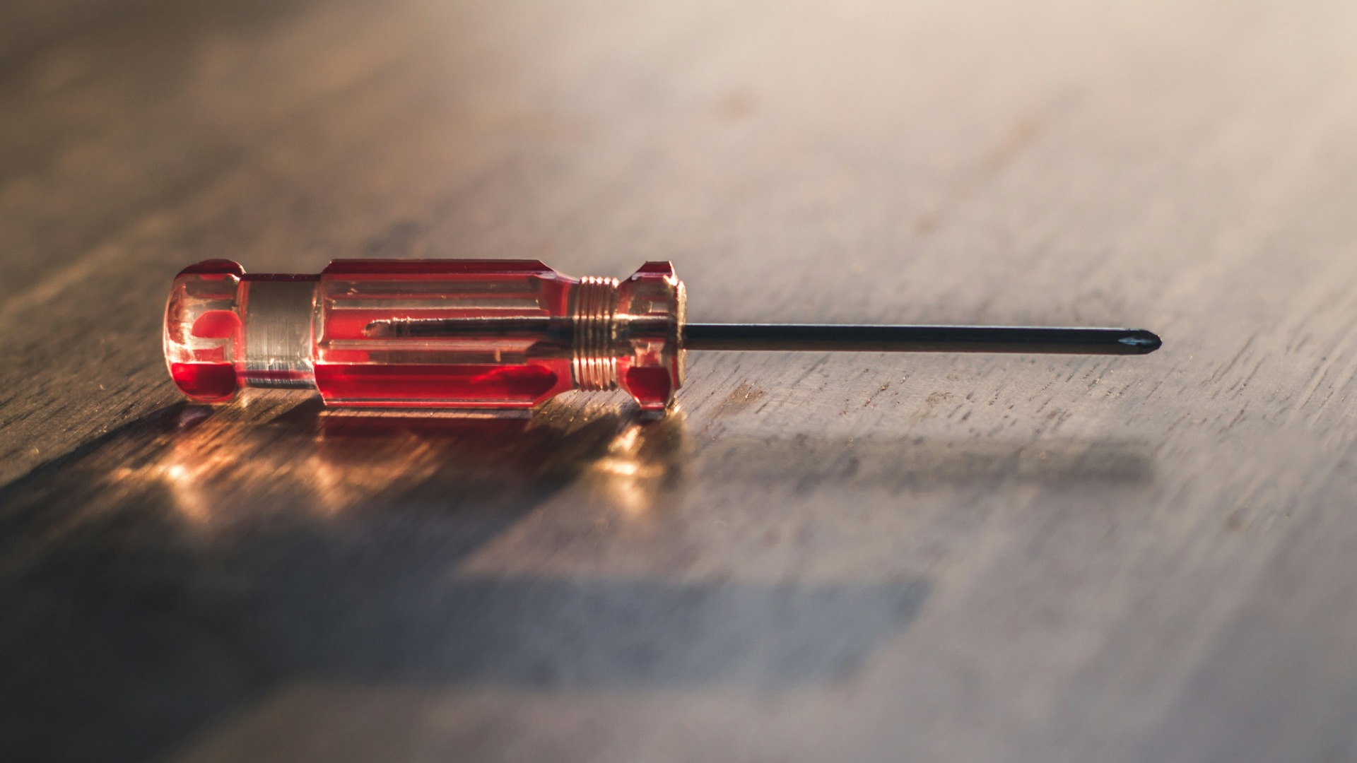 red and silver screw driver