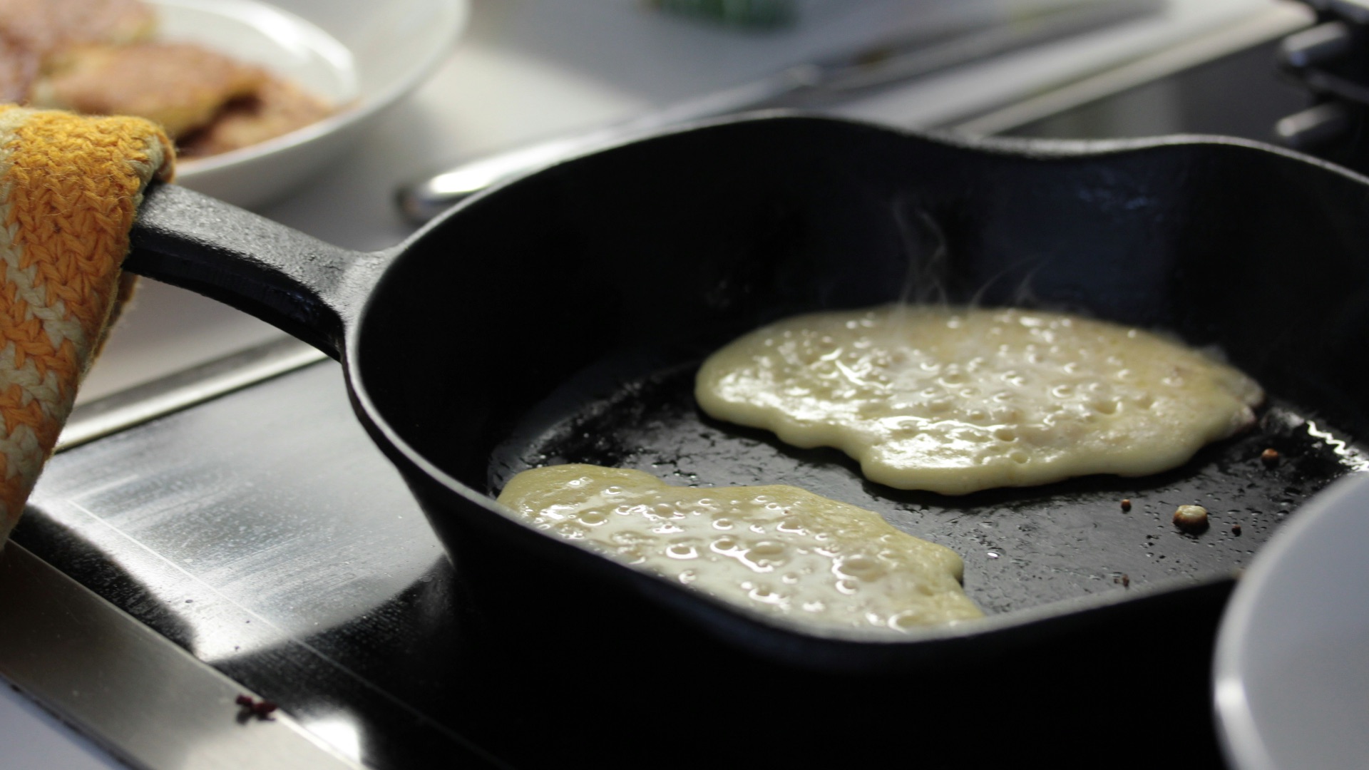 a frying pan filled with food on top of a stove