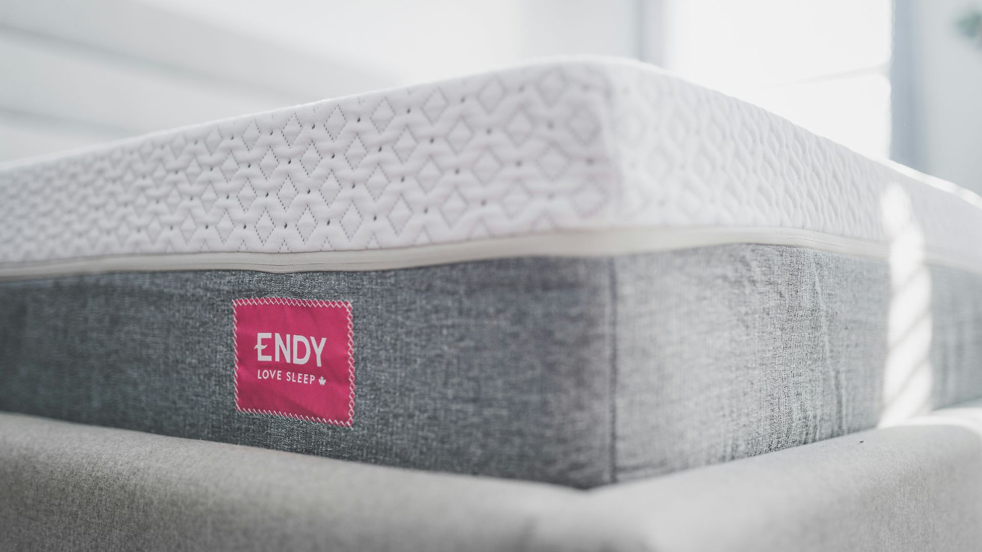 a close up of a mattress with a red label on it
