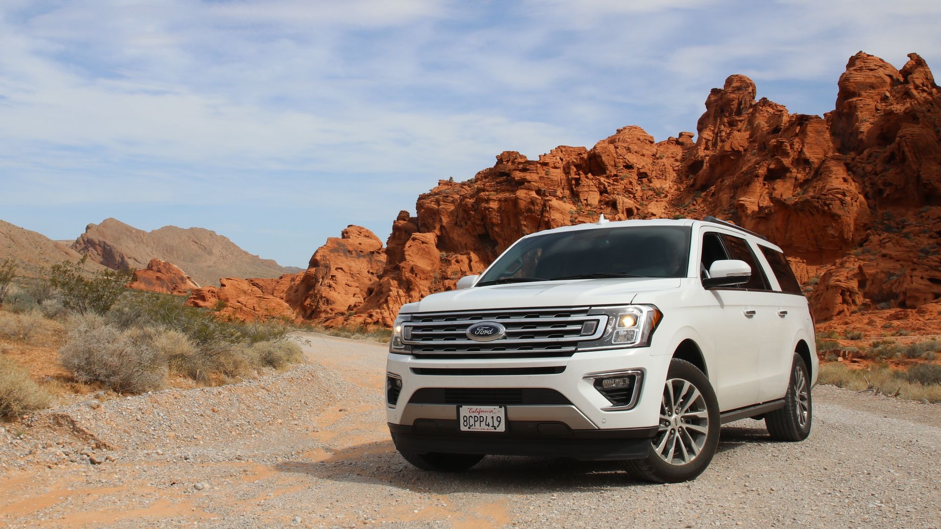 parked white Ford Explorer SUV