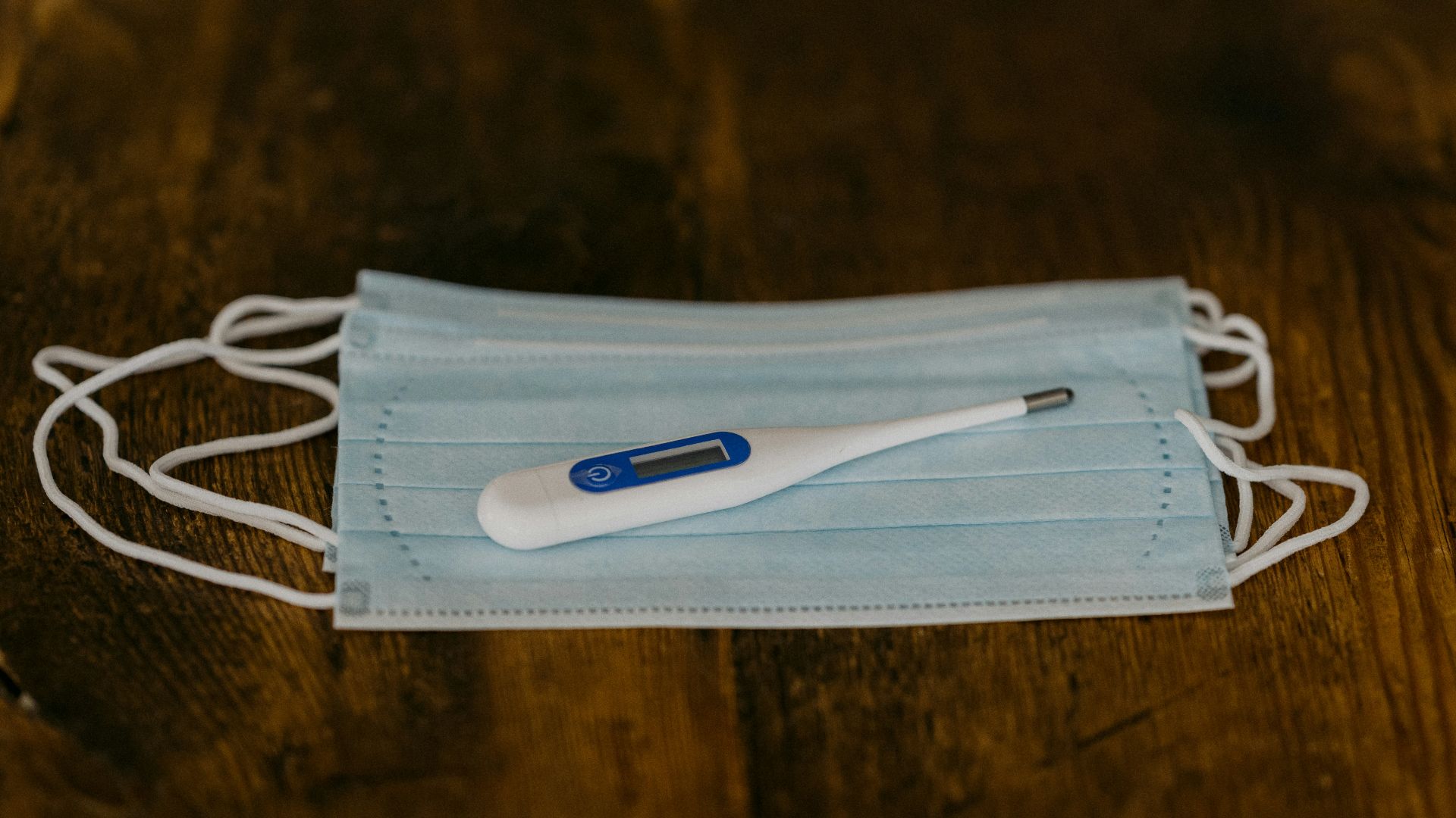 white and blue toothbrush on white textile