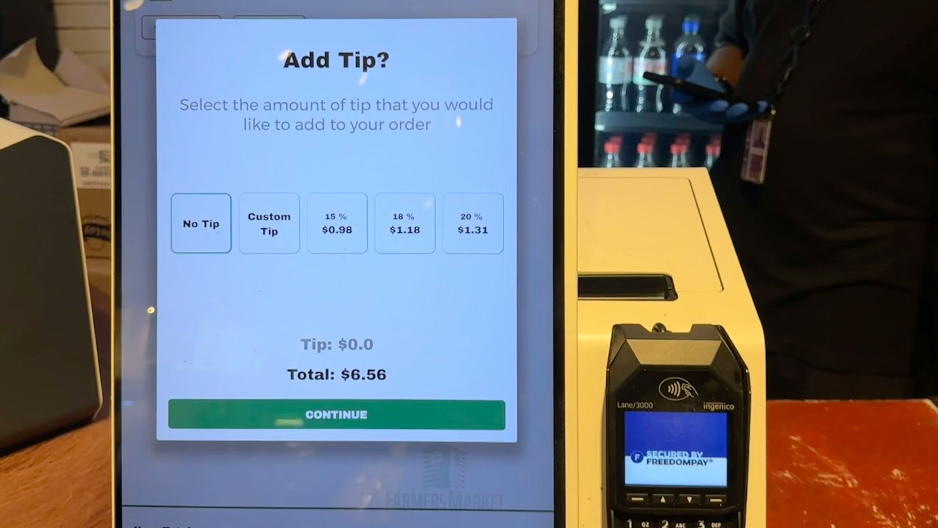 A checkout counter with a cell phone on it