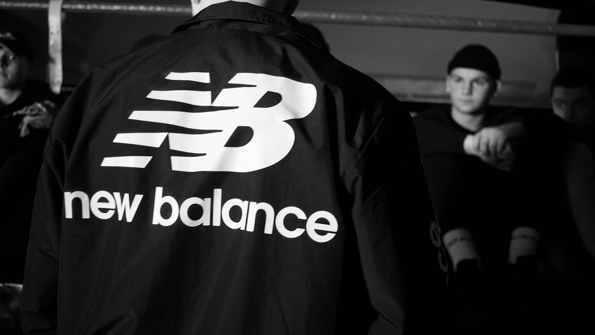 man in black and white adidas jacket