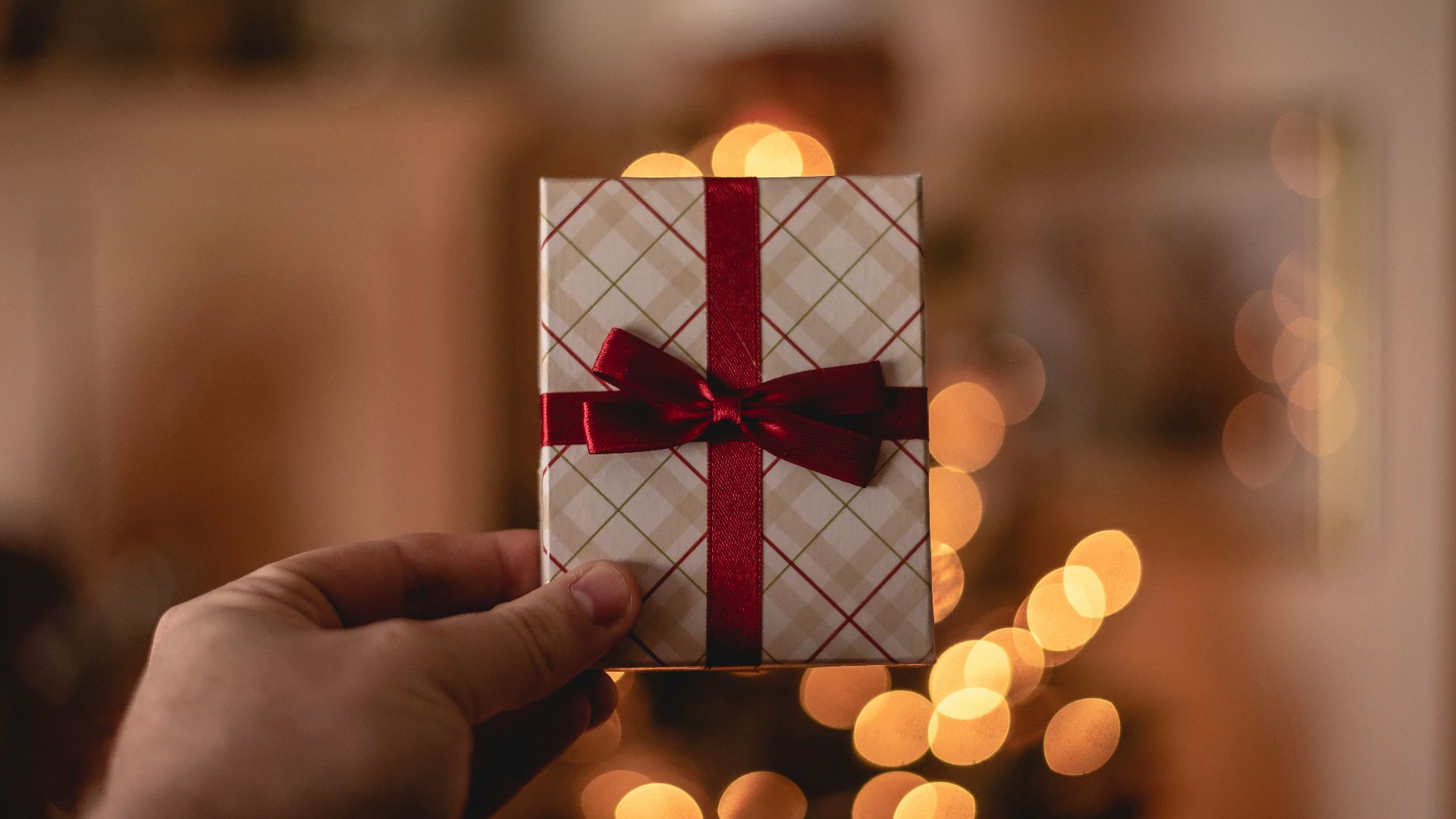 person holding white gift card