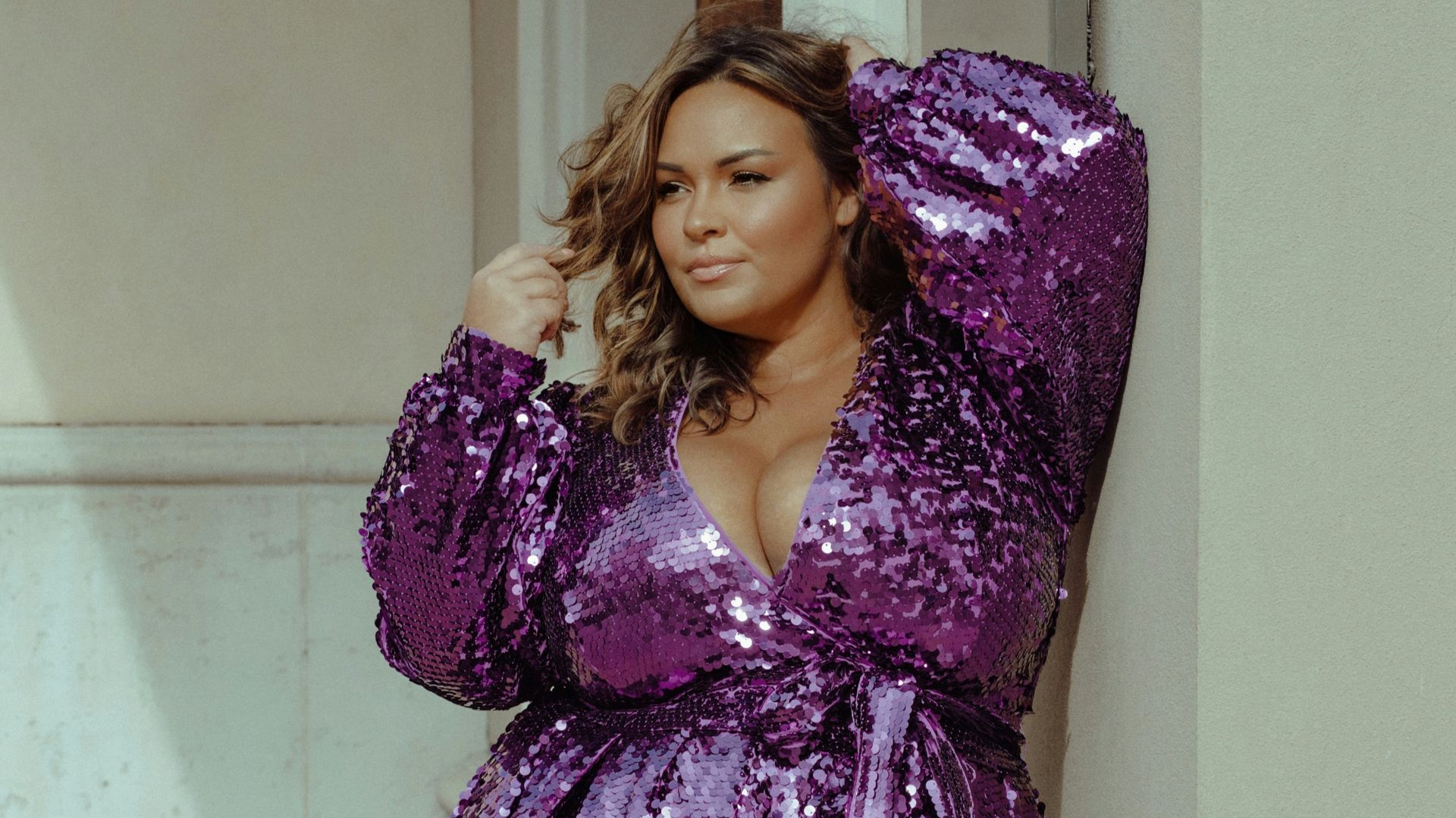 a woman wearing a purple dress