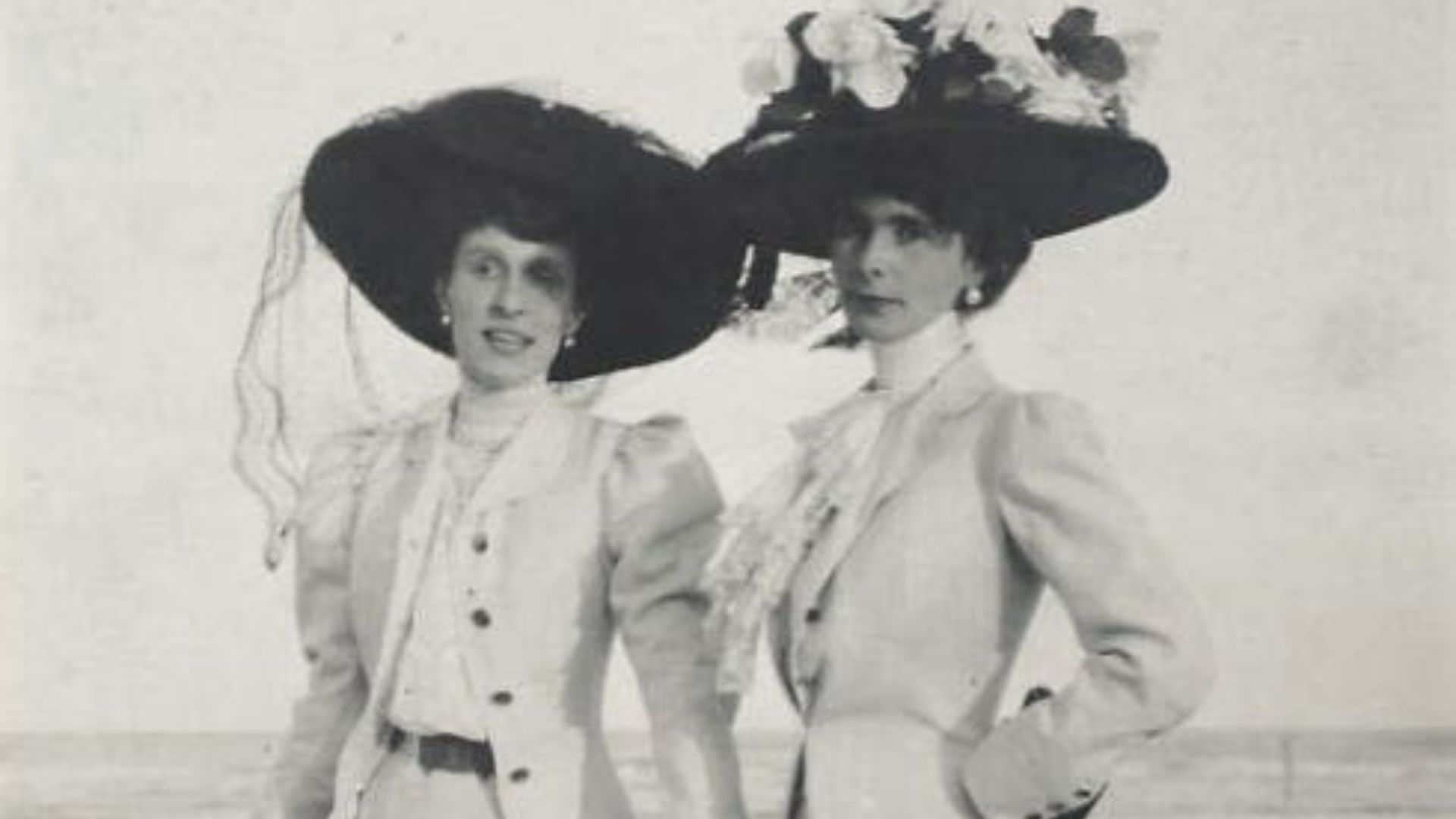 File:Two Women on Beach wearing large black hats 1900s.jpg