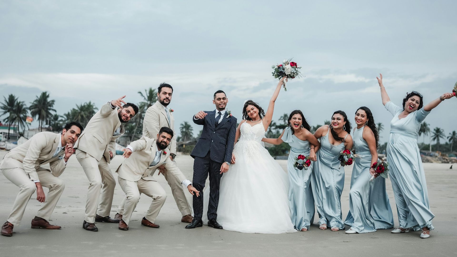 A group of people standing next to each other on a beach