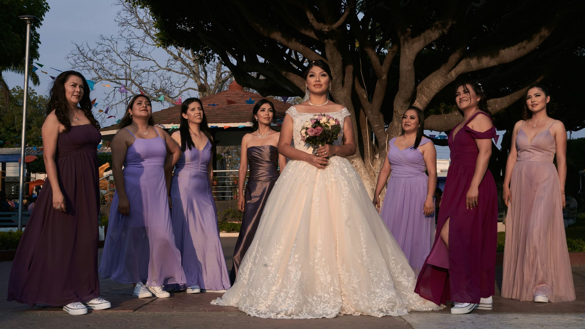 a group of women in dresses