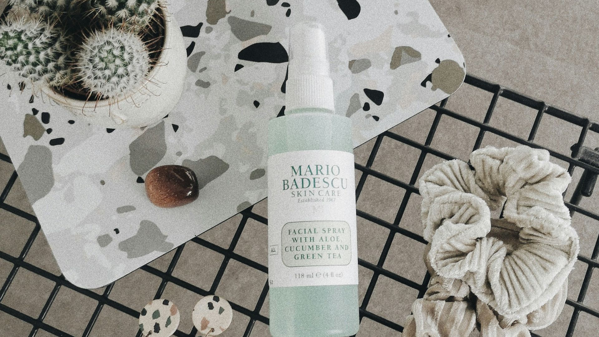 white and green labeled soft tube